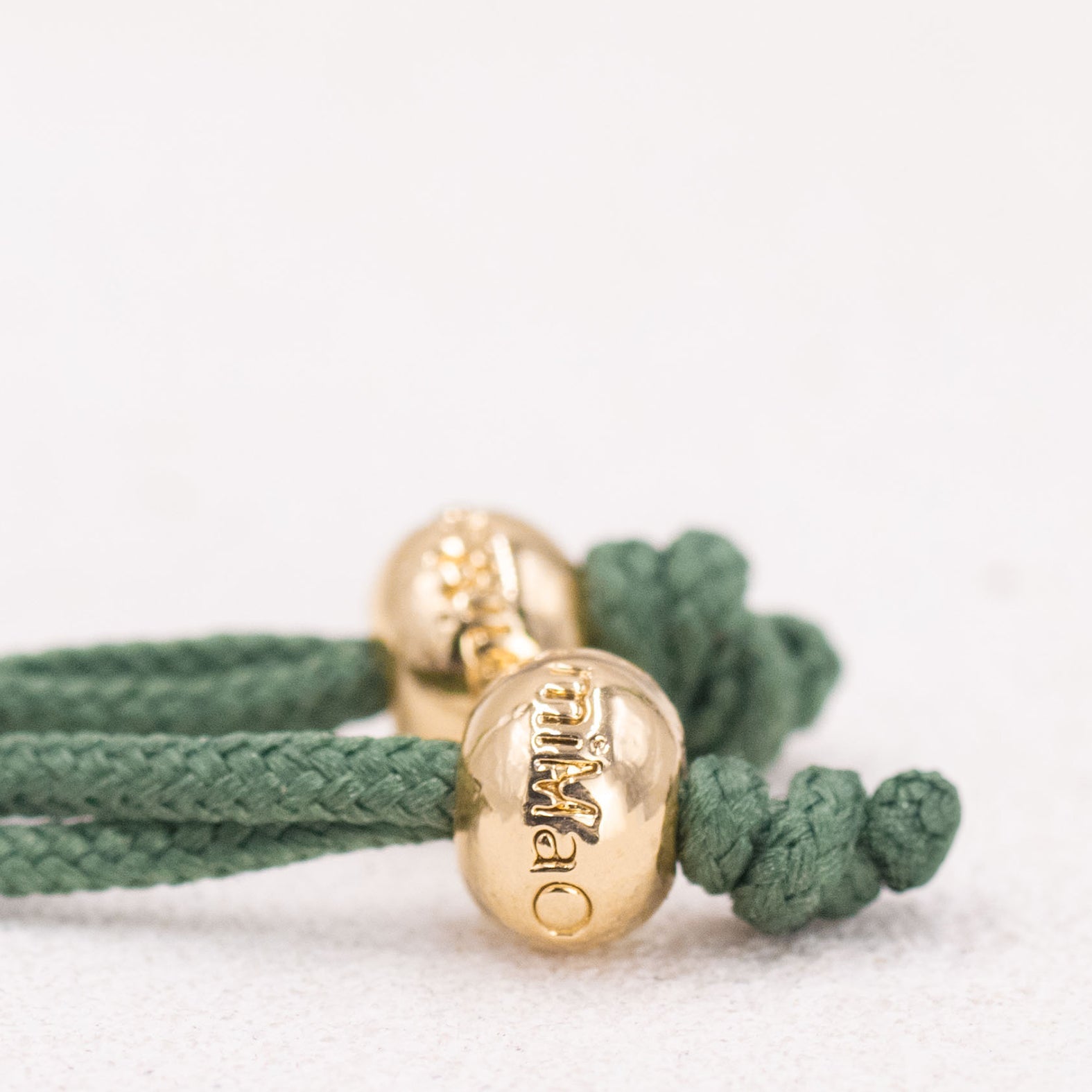 PULSERA VERDE MUSGO DE LA SALUD ORO
