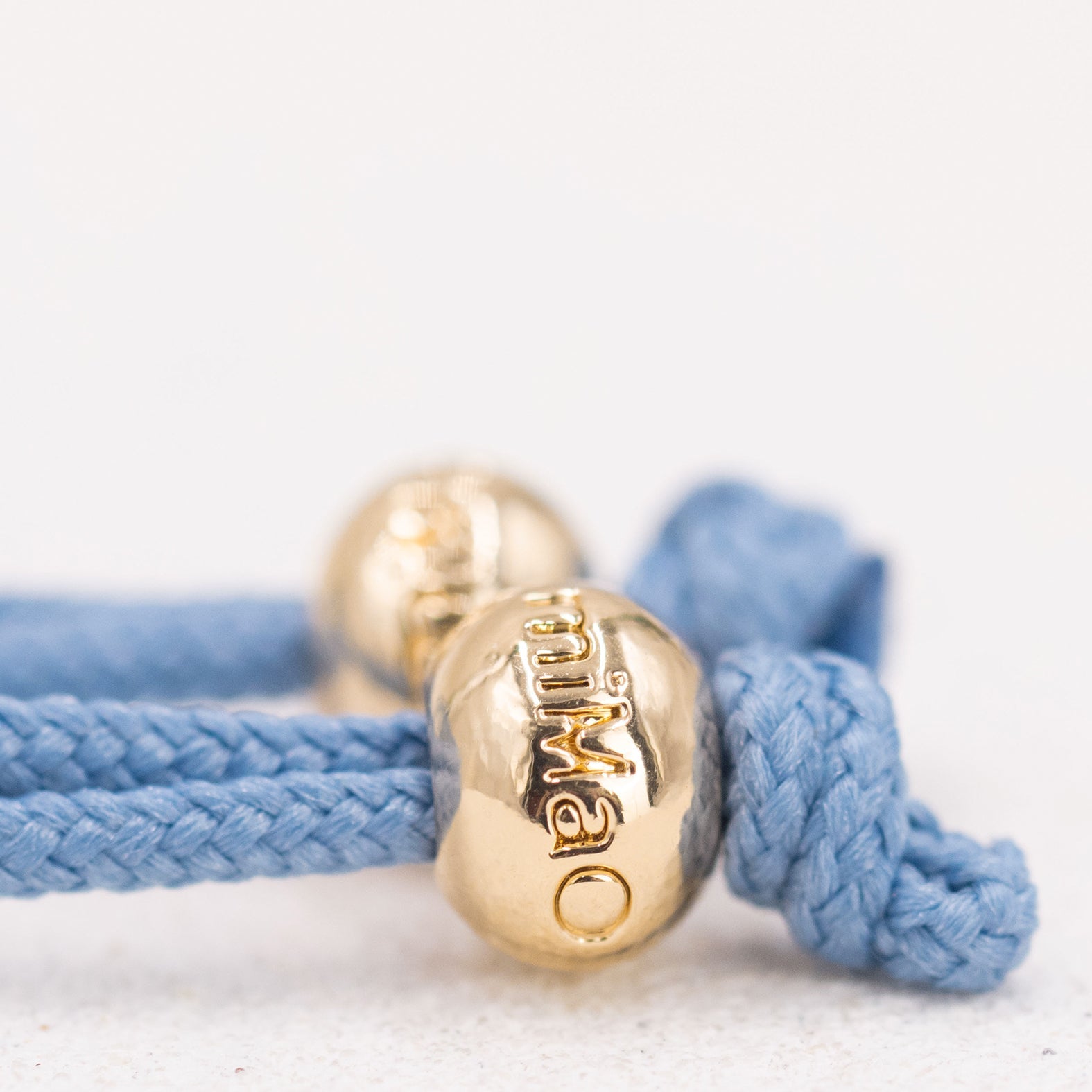 PULSERA AZUL DE LA PAZ ORO