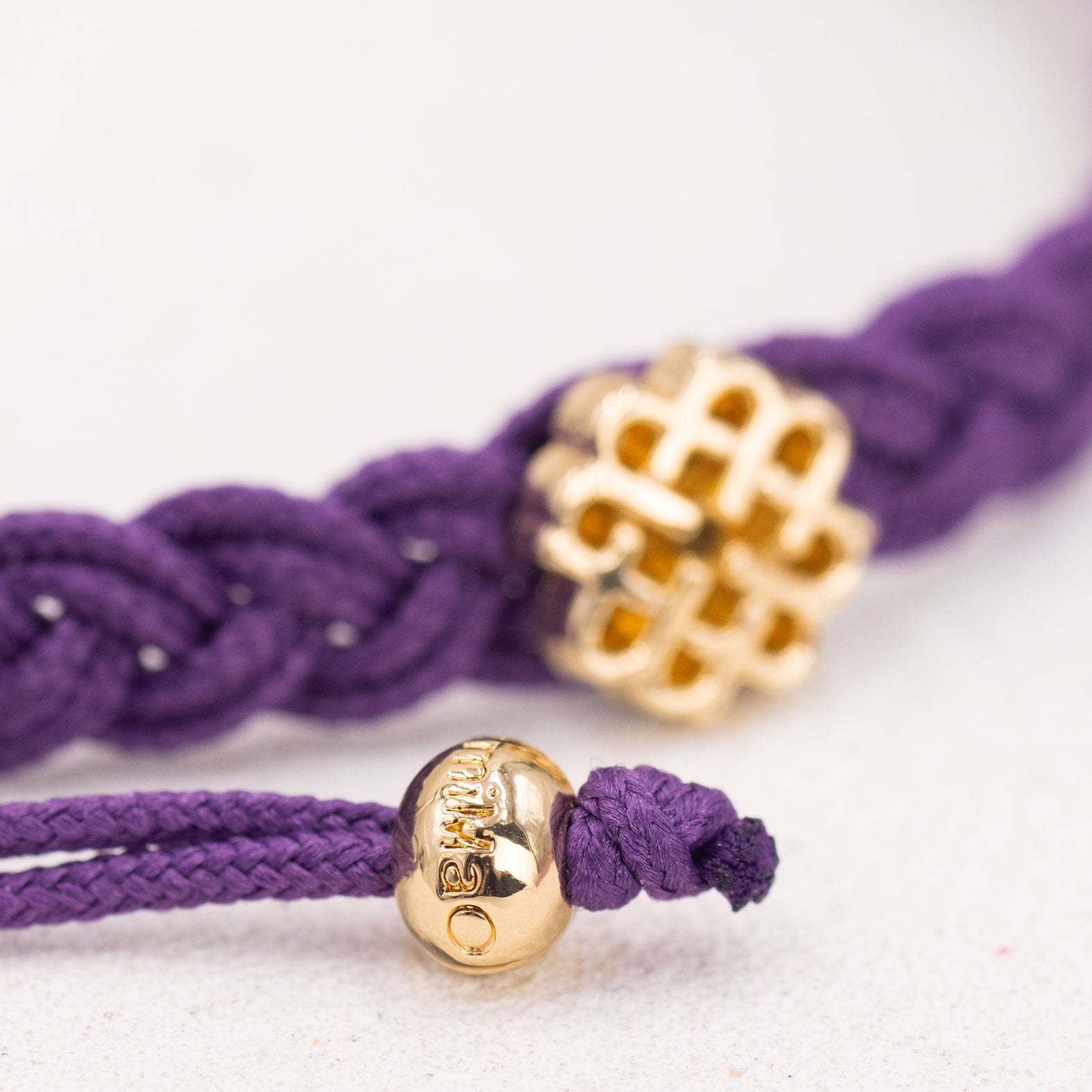 PULSERA MORADA DE LA CREATIVIDAD ORO